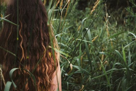 Young Girl Standing In Tall Grass Outside By Gabriel Gabi Bucataru