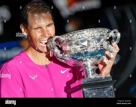 Spanish Tennis Player Rafael Nadal Posing With The Championship Trophy