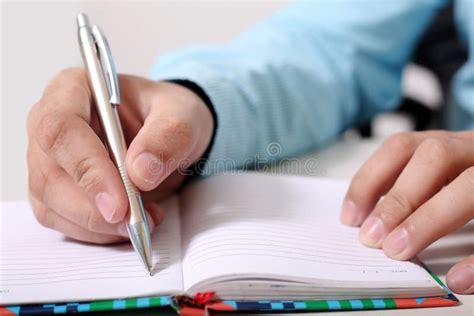 Man Is Writing Work On Notebook With Pen Stock Image Image Of Student
