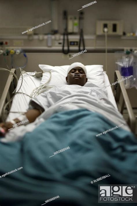 High Angle View Of A Patient Lying On A Hospital Bed Stock Photo
