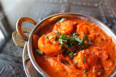 3 spanish onions, halved · 4 garlic cloves · 2 sticks magical ghee · ¼ cup chicken stock or water · 3 family size cans (23.2 oz.) condensed campbells tomato soup · 6 . SHRIMP TIKKA MASALA - Taj Restaurant