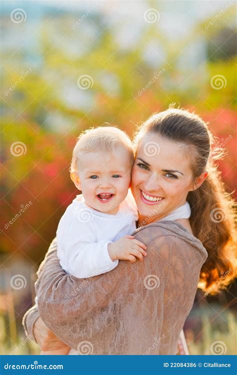 Happy Mother With Smiling Baby On Street Stock Photo Image Of Enjoy