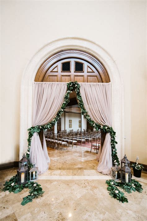 Draped Wedding Entryway Featured A Full Garland Of Lemon Leaf And