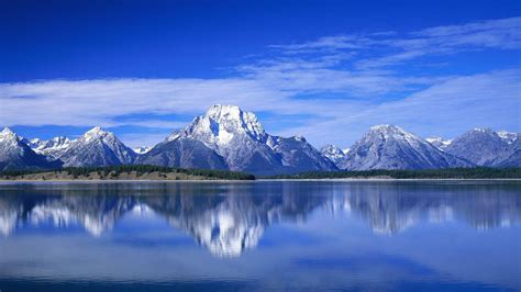 Landscape View Of Mountain Under Blue Cloudy Sky With