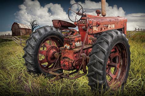 Abandoned Old Farmall Tractor In A Grassy Field Photograph By Randall