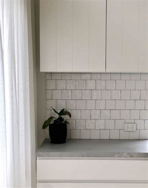 Using dark grout in your kitchen splashback can help hide hard to clean stains and provide a chic contrast against white tiles. Pin on Splashback Tiles