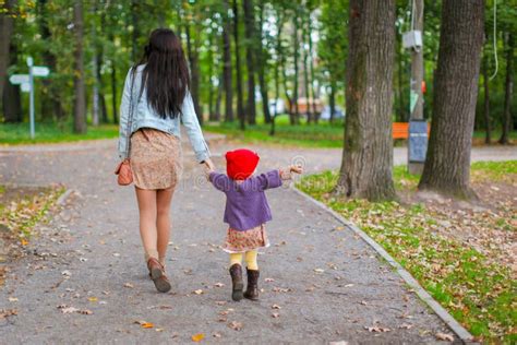 Young Mother Walking With Her Little Daughter In Stock Image Image Of