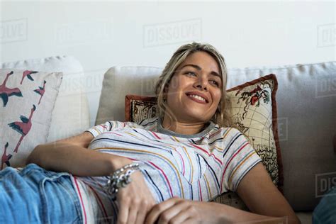 Woman Relaxing On Sofa Stock Photo Dissolve