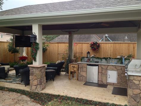 Poolside Patio Featuring Stone Kitchen And Bar