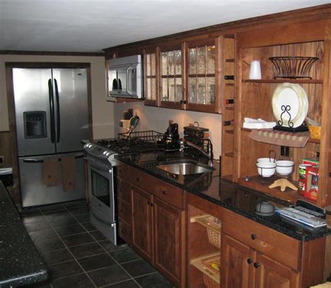 Simple cabinets don't apply to large spaces. Breathtaking Simple Country Kitchen Cabinet with Black Ceramic Floor Tile and Black Granite ...