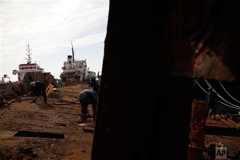 Greece Hauls Abandoned Half Sunken Ships Out Of The Sea — Ap Photos