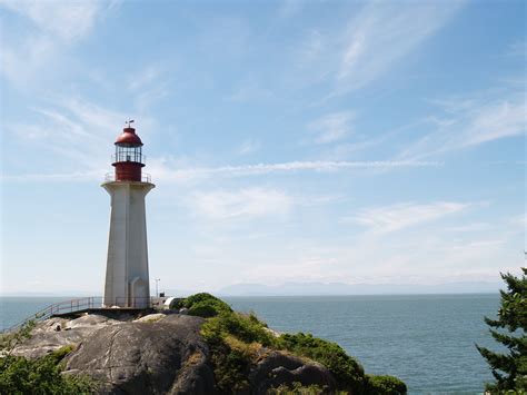 Free Images Sea Coast Ocean Lighthouse Architecture Sky Skyline