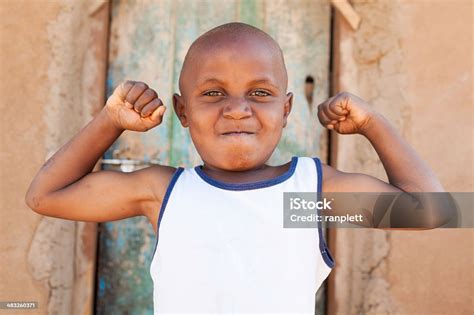 Young African Boy Flexing Muscles Stock Photo Download Image Now