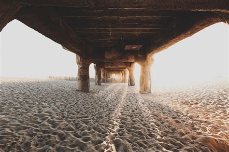 Free Photo Underneath The Wooden Bridge At Sandy Beach