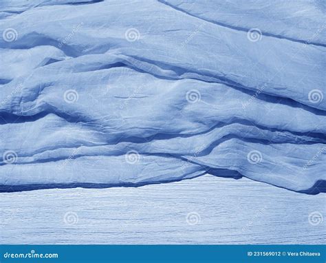 Blue Wrinkled Crumpled Light Fabric On The Bed The Texture Of The