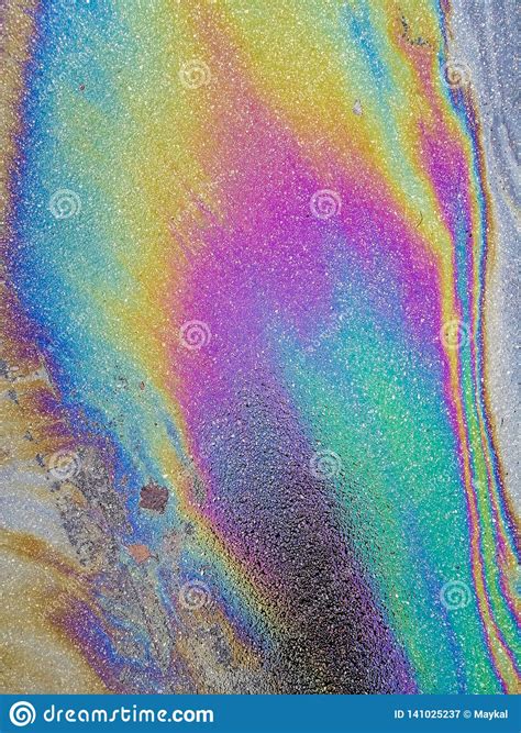 Multi Colored Oil Spill On Asphalt Road Abstract Background Stock