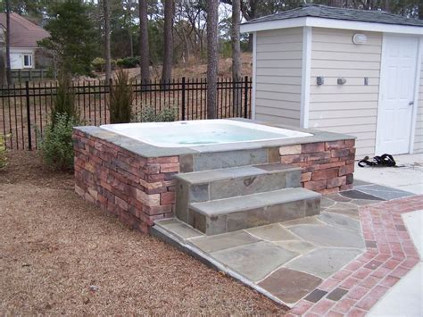 Preparing a good foundation or spa pad. Stone Hot Tub Surround | Sandscapes | Pinterest | Tub ...