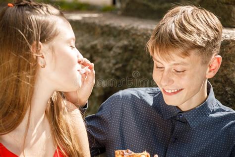 Young Couple On A Romantic Date The Guy Feeds The Girl With A Spoon Stock Image Image Of