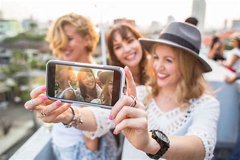 Group Of Three Girlfriends Taking A Selfie By Jovo Jovanovic Party