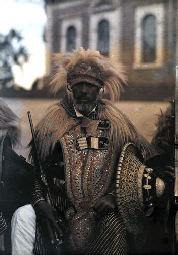 Africa A Venerable Warrior With Headdress And Lion Mane Collar