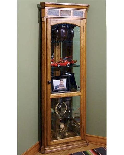 Show off your souvenirs, sculptures, china,show off your souvenirs, sculptures, china, photos and other classic pieces in timeless style, with this exquisite lighted corner curio cabinet. Sedona Corner Curio by Sunny Designs SU-2513RO