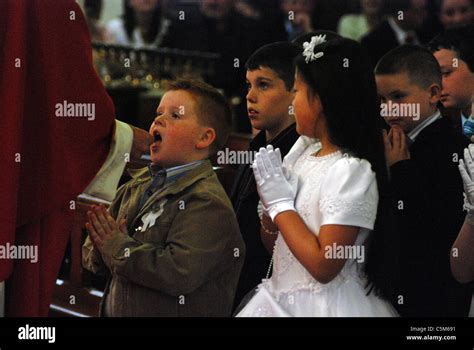 Children Receive First Communion At A Roman Catholic Church In Ireland