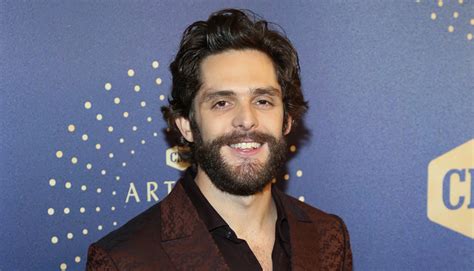 Thomas Rhett Goes Shirtless While Attempting to Swing from a Branch
