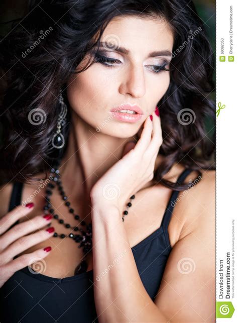 close up portrait of gorgeous brunette woman with perfect makeup and hairstyle stock image