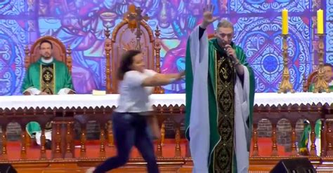 woman shoves anti gay priest off stage mid service pinknews