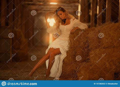 Beautiful Glamorous Girl In A Stable On A Haystack Stock Photo Image