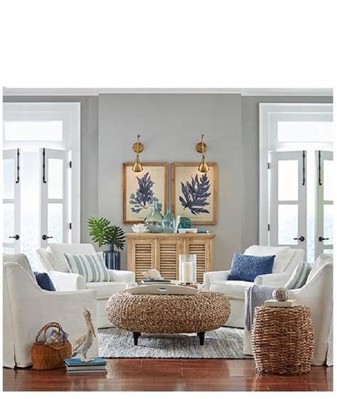 A beachy living room with a gorgeous artwork, light blue chairs, a cork table and a rug. Best 34 Cheap Coastal Living Room Furniture Ideas | Coastal living rooms, Home living room ...
