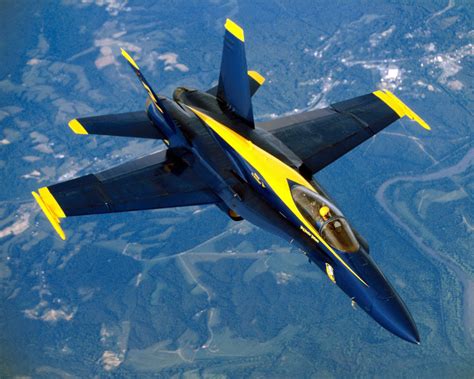 An F A 18 Hornet Aircraft From The Blue Angels Slides Back Into Formation After Receiving Fuel