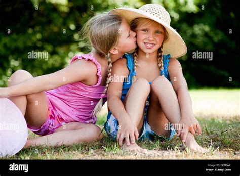 Kiss On My Sisters Cheek Stock Photo Alamy