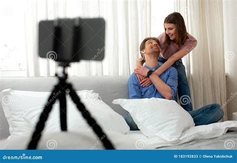 Happy Couple Taking Photo Of Themselves By Smartphone Stock Image
