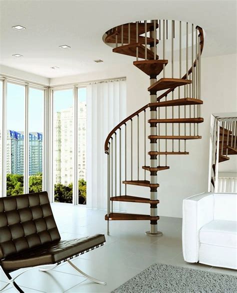 A Living Room With A Chair And A Spiral Staircase