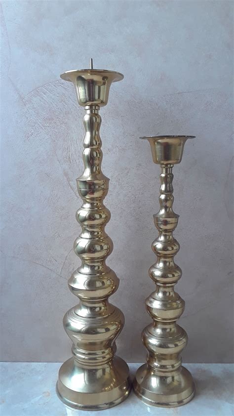 Or, glass may be used as a decorative element of the candle holder, such as the use of antique glass prisms for embellishment. Pair of Vintage Brass Taper Candle Holders, Tall Brass ...