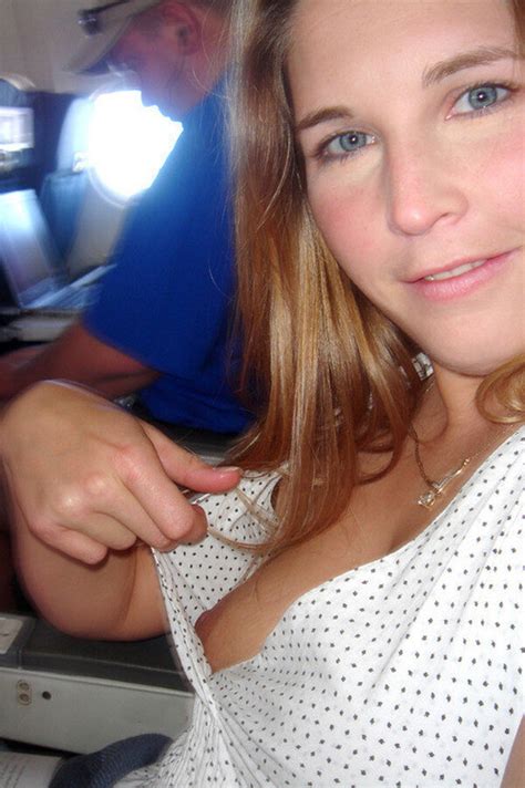 cutie flashing her tit in her airplane seat see pornguy68