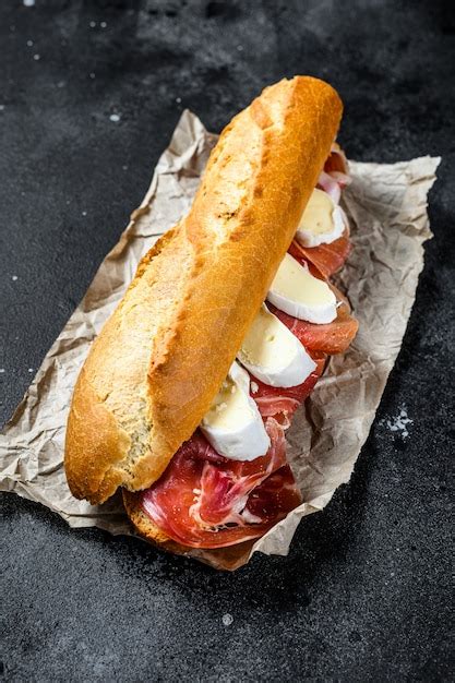 Premium Photo Baguette Sandwich With Jamon Ham Serrano Paleta Iberica Camembert Cheese