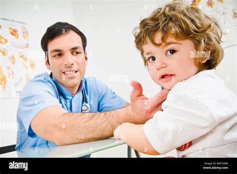 Doctor Examining A Baby Boy Stock Photo Alamy