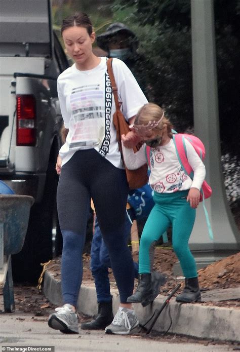 Olivia Wilde is causal in t-shirt and leggings as she runs errands with 