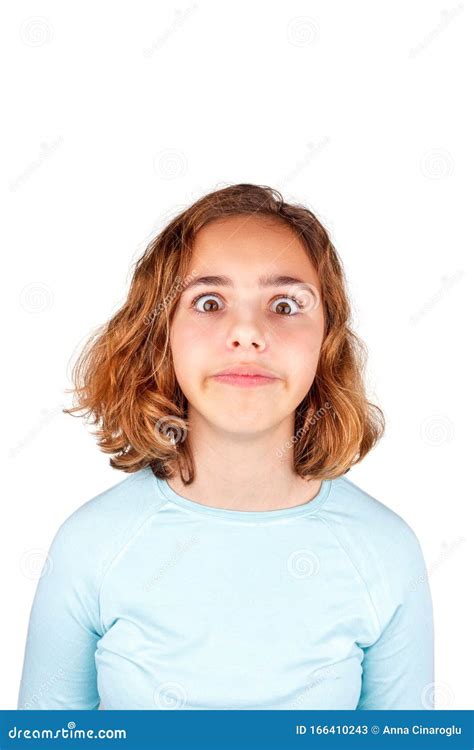 cute teenager girl with funny face expression looking to camera isolated april fool day stock