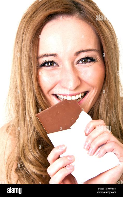 Young Woman Eats Chocolate Stock Photo Alamy
