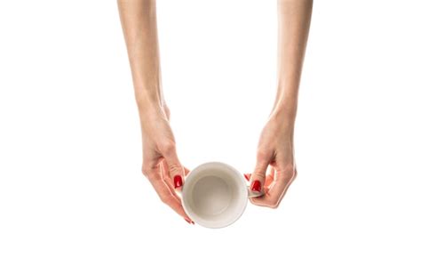 Premium Photo Female Hands Hold A White Ceramic Cup On White