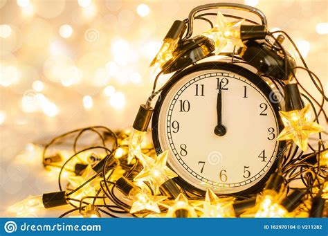 New Year Alarm Clock Wrapped Into Festive Star Garland Midnight Stock
