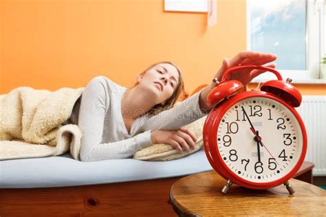 Woman Waking Up Turning Off Alarm Clock In Morning Stock Image Image Of Awake Bell 65387391
