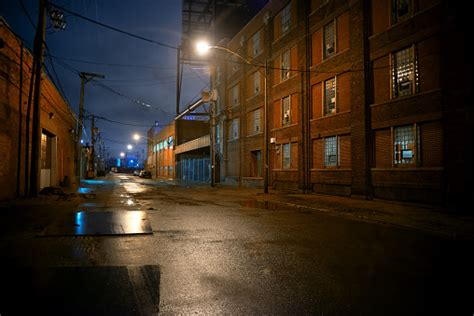 Dark And Eerie Industrial Urban City Street At Night In Chicago Stock