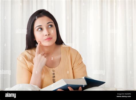 Young Woman Holding Book Stock Photo Alamy
