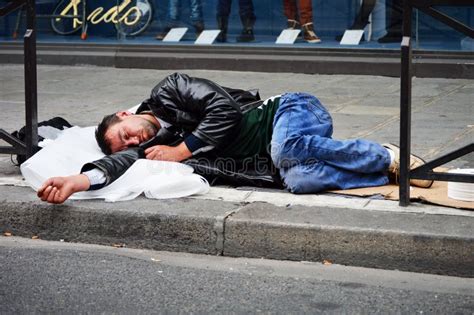 Homeless Man Sleeping On The Street In Paris Editorial Stock Image