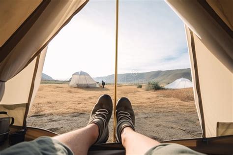 Beautiful Scenery As Viewed From Inside A Cozy Tent With Feet Sticking Out And A Cup Of Hot