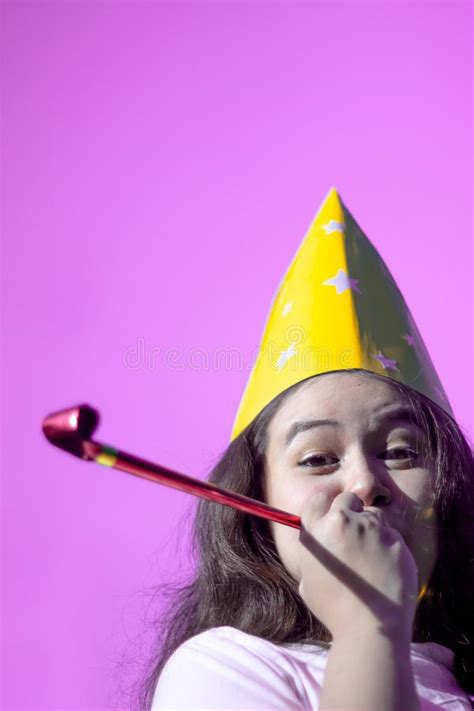 Cute Women Wearing Party Hat Cheering And Celebrating Blowing Party